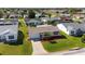 Aerial view showcasing a lovely home with a well-kept lawn and mature landscaping at 2013 Cardona Way, The Villages, FL 32159
