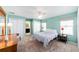 Bedroom featuring carpet, light blue walls, ceiling fan, and natural light at 2013 Cardona Way, The Villages, FL 32159