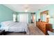 Bedroom featuring carpet, light blue walls, and double closets at 2013 Cardona Way, The Villages, FL 32159