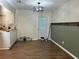 Cozy dining room featuring wood-look floors and an updated light fixture at 23 Juniper Pass Ln, Ocala, FL 34480