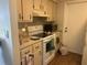 Functional kitchen featuring white appliances and lots of cabinet space at 23 Juniper Pass Ln, Ocala, FL 34480