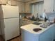 Charming kitchen featuring white cabinets and modern appliances at 23 Juniper Pass Ln, Ocala, FL 34480