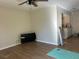 Spacious living room with wood-look floors with views of kitchen at 23 Juniper Pass Ln, Ocala, FL 34480