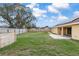 Large, grassy, fenced backyard with plenty of room for recreation or relaxation at 234 Locust Pass Loop, Ocala, FL 34472