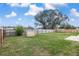 Large, grassy, fenced backyard with plenty of room for recreation or relaxation at 234 Locust Pass Loop, Ocala, FL 34472