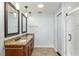 Bathroom featuring granite counters and a dual sink vanity at 234 Locust Pass Loop, Ocala, FL 34472