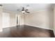 Spacious bedroom features rich dark wood floors and a ceiling fan at 234 Locust Pass Loop, Ocala, FL 34472
