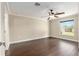 Bedroom featuring a ceiling fan, hardwood floors and plenty of natural light at 234 Locust Pass Loop, Ocala, FL 34472