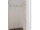 Walk in closet has metal shelving and gray wood-look flooring at 234 Locust Pass Loop, Ocala, FL 34472