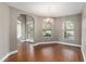 Bright dining room with wood flooring, elegant chandelier, and arched doorways, perfect for entertaining at 234 Locust Pass Loop, Ocala, FL 34472