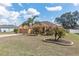 Beautiful single Gathering home with a front yard featuring mature palm trees at 234 Locust Pass Loop, Ocala, FL 34472