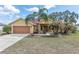 Well-maintained single Gathering home with a lush front yard and charming curb appeal at 234 Locust Pass Loop, Ocala, FL 34472