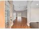 Inviting foyer with hardwood floors, neutral paint, and an open view into the living spaces of the home at 234 Locust Pass Loop, Ocala, FL 34472