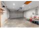 Spacious two car garage with high ceilings, overhead lighting, and plenty of room for storage at 234 Locust Pass Loop, Ocala, FL 34472