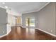 Bright living area with hardwood floors and sliding glass doors to the backyard at 234 Locust Pass Loop, Ocala, FL 34472