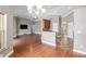 Open-concept living space with hardwood floors and views of the kitchen and dining areas at 234 Locust Pass Loop, Ocala, FL 34472