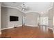 Large living room with vaulted ceilings, hardwood floors, and an open floor plan at 234 Locust Pass Loop, Ocala, FL 34472