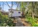 A well-maintained storage shed can be found in the backyard with a brick path at 3060 Ne 35Th St, Ocala, FL 34479