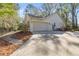 Garage side of home with long driveway and well-maintained yard at 3060 Ne 35Th St, Ocala, FL 34479