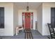 Charming front porch featuring a red door, decorative wreath, and seasonal decorations at 3060 Ne 35Th St, Ocala, FL 34479