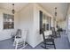 Inviting front porch with rocking chairs, offering a relaxing outdoor space at 3060 Ne 35Th St, Ocala, FL 34479