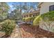 Charming home exterior with mature landscaping and covered front porch at 3060 Ne 35Th St, Ocala, FL 34479