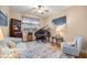 Cozy room featuring a piano, decorative rug, and comfortable seating at 3060 Ne 35Th St, Ocala, FL 34479