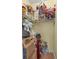 A walk-in closet featuring shelves full of decorations and storage items at 3060 Ne 35Th St, Ocala, FL 34479