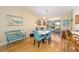 Dining area with bright decor and furniture, hardwood floors, and view of sunroom at 3321 Woodridge Dr, The Villages, FL 32162