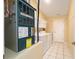 Convenient laundry room with a washer, dryer, ample storage, and a door for easy access at 3321 Woodridge Dr, The Villages, FL 32162