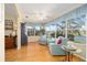 Cozy sunroom with views of the lake, bright decor and hardwood floors at 3321 Woodridge Dr, The Villages, FL 32162