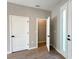 Bedroom with tile floors and walk-in closet; an adjacent door and window provide ample lighting at 3628 Sw 133Rd Loop, Ocala, FL 34473