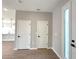 Bright foyer featuring tile flooring, two-door closet, and view into open-concept area and large front door with sidelight at 3628 Sw 133Rd Loop, Ocala, FL 34473