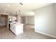 The kitchen features a center island with a sink and stainless steel appliances at 3628 Sw 133Rd Loop, Ocala, FL 34473