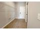 Functional laundry room with tile floors, wire shelving, and washer/dryer hookups at 3628 Sw 133Rd Loop, Ocala, FL 34473