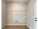 Convenient laundry room featuring tile floors, a wire shelf, and washer/dryer connections at 3628 Sw 133Rd Loop, Ocala, FL 34473