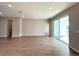 Spacious living room with recessed lighting, neutral walls, and sliding glass doors at 3628 Sw 133Rd Loop, Ocala, FL 34473