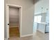 A convenient pantry with shelving is located adjacent to the kitchen area at 3628 Sw 133Rd Loop, Ocala, FL 34473