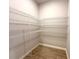 Spacious walk-in closet with ample shelving for organization and storage at 3628 Sw 133Rd Loop, Ocala, FL 34473