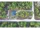 An aerial view of a charming home nestled among lush trees at 3896 Sw 177Th Ter, Dunnellon, FL 34432