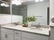 Bright bathroom featuring double sinks with granite countertops, and views of the walk-in shower at 3896 Sw 177Th Ter, Dunnellon, FL 34432