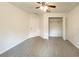 Bright bedroom featuring plush carpet, a ceiling fan, closet and a door to the side at 3896 Sw 177Th Ter, Dunnellon, FL 34432