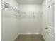 Walk-in closet with white wire shelving and neutral carpeting at 3896 Sw 177Th Ter, Dunnellon, FL 34432