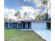 Charming single-story home with a neatly maintained lawn and a two-car garage at 3896 Sw 177Th Ter, Dunnellon, FL 34432