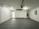 Spacious garage featuring gray flooring, ample storage space, and a garage door opener at 3896 Sw 177Th Ter, Dunnellon, FL 34432