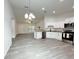 Bright kitchen with a breakfast bar, stainless appliances, and wood-look flooring at 3896 Sw 177Th Ter, Dunnellon, FL 34432