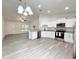 Bright kitchen with a breakfast bar, stainless appliances, and wood-look flooring at 3896 Sw 177Th Ter, Dunnellon, FL 34432
