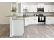 Kitchen featuring white cabinets, granite counters, and stainless steel appliances at 3896 Sw 177Th Ter, Dunnellon, FL 34432