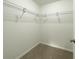 Walk-in closet featuring shelving and carpeted floor at 3896 Sw 177Th Ter, Dunnellon, FL 34432