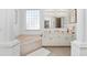 Bright bathroom with a soaking tub, double vanity, and window offering natural light at 5891 Nw 26Th St, Ocala, FL 34482